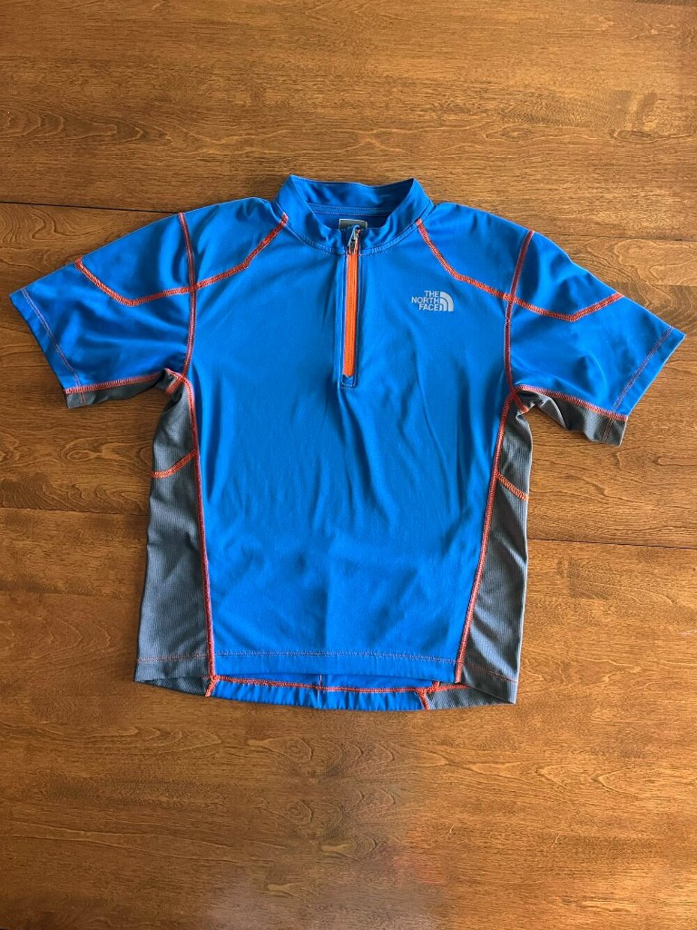 The North Face blue cycling shirt M 10/12